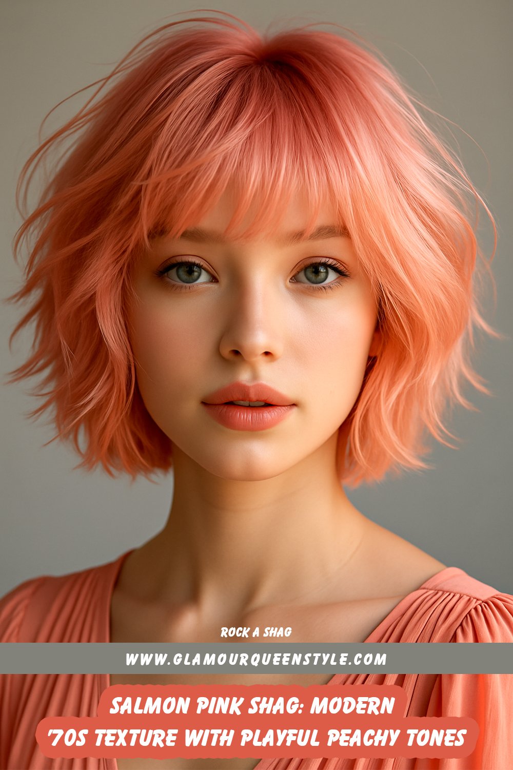 Person wearing a salmon pink shag haircut featuring feathered layers and curtain bangs; styled for texture and paired with trendy retro fashion pieces.
