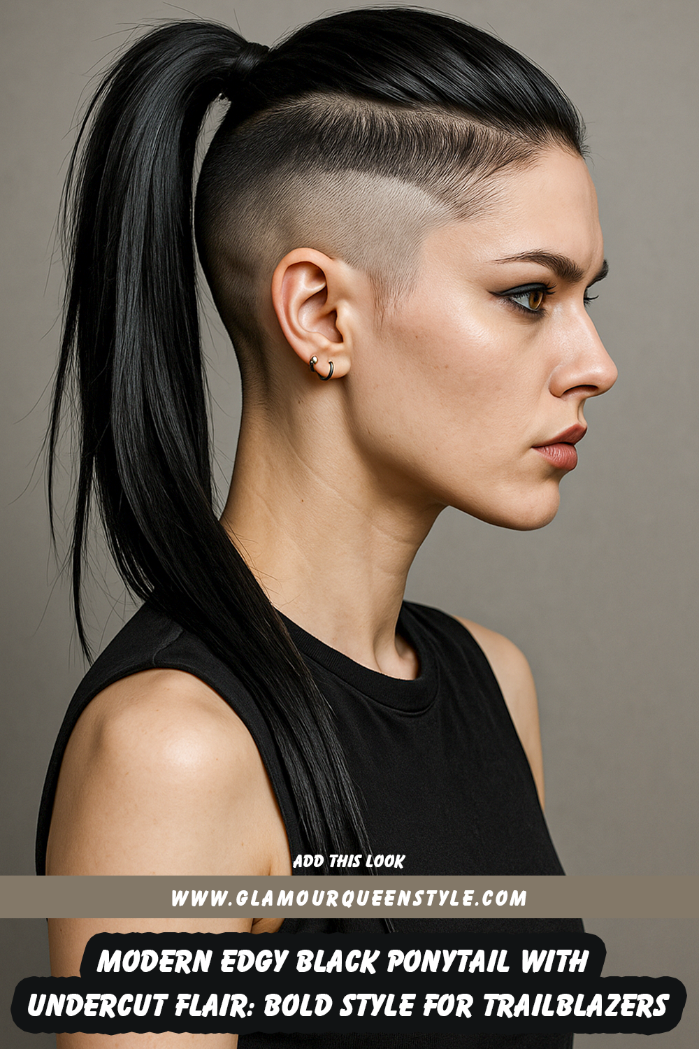 Woman rocking a sleek black ponytail paired with an undercut; her strong makeup features striking eyeliner and she wears contemporary statement clothing.