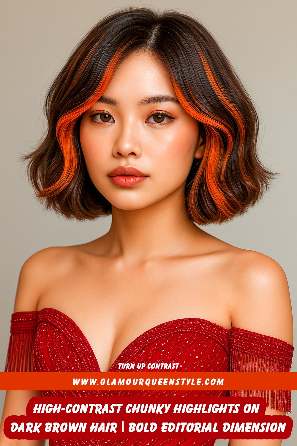 Woman showcasing dark brown hair styled in an angular cut with thick, high-contrast chunky blonde highlights for a bold dimensional effect.