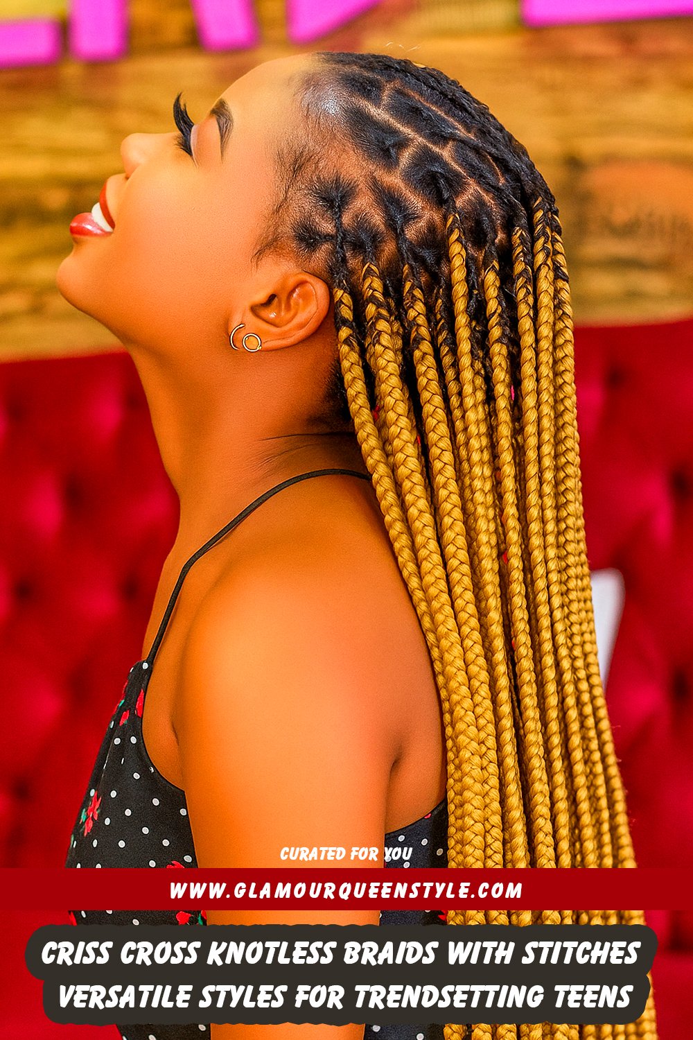 Black teen girl wearing intricate criss cross knotless braids featuring stitch accents and curly ends; styled in trendy streetwear fashion accessorized with hoop earrings.