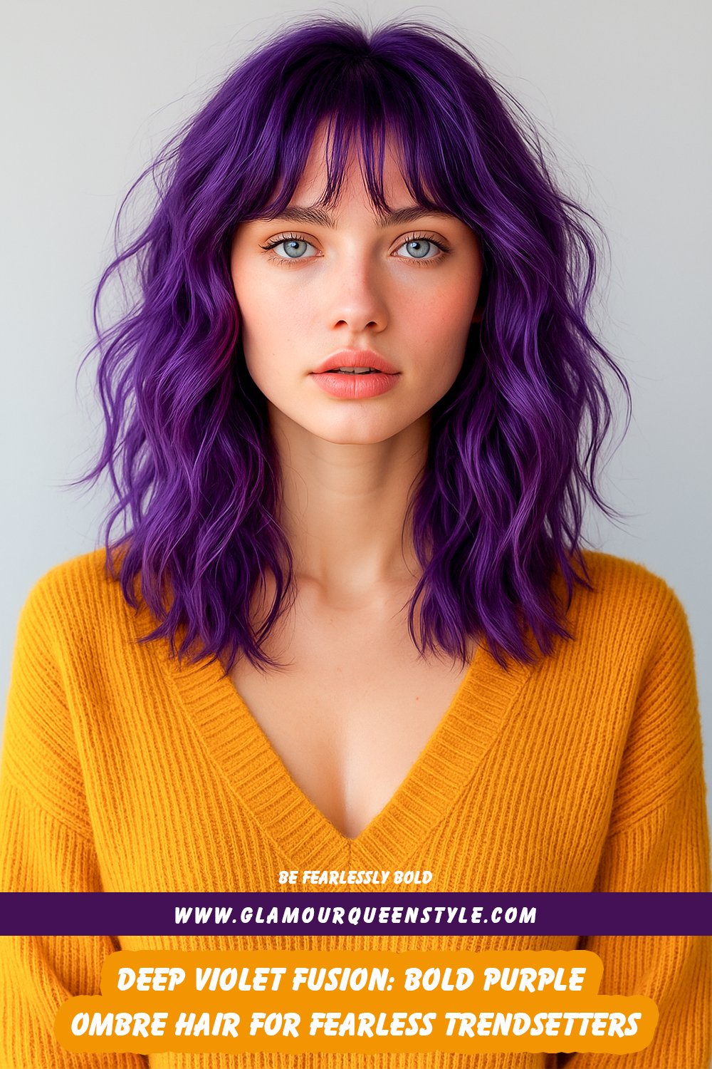 Woman showcasing deep violet ombre hair transitioning from dark purple roots through bright mid-sections to pastel ends; finished with sharp makeup and a tailored black blazer.