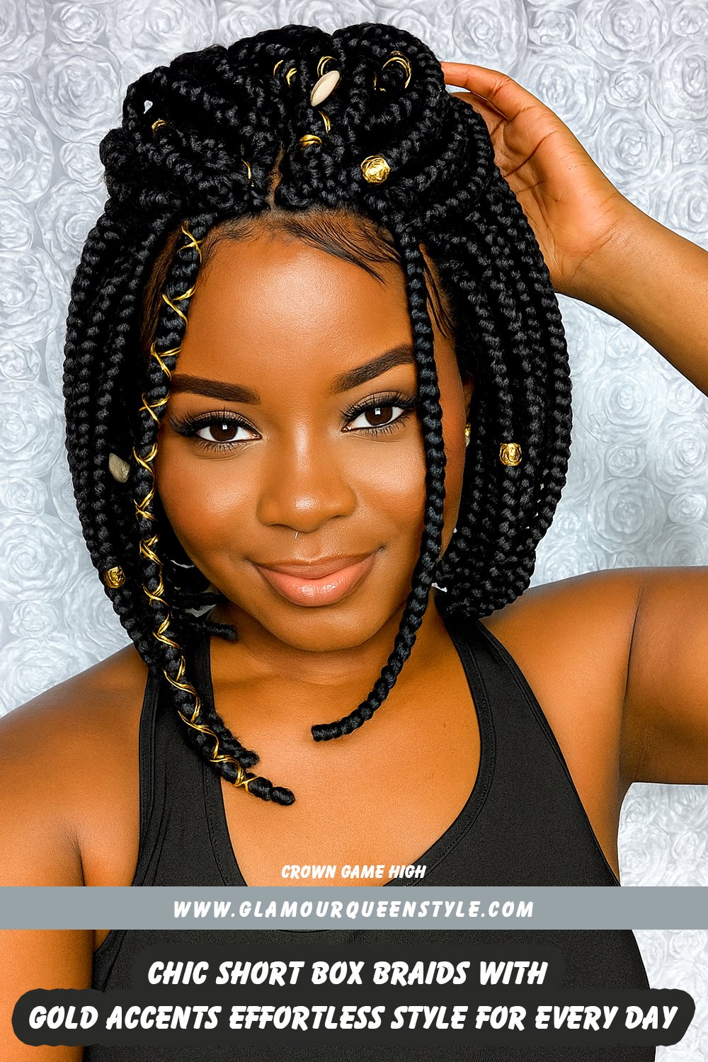 Woman wearing neat, chin-length box braids adorned with gold string accents; her hair frames her round face beautifully, paired with trendy fashion accessories.