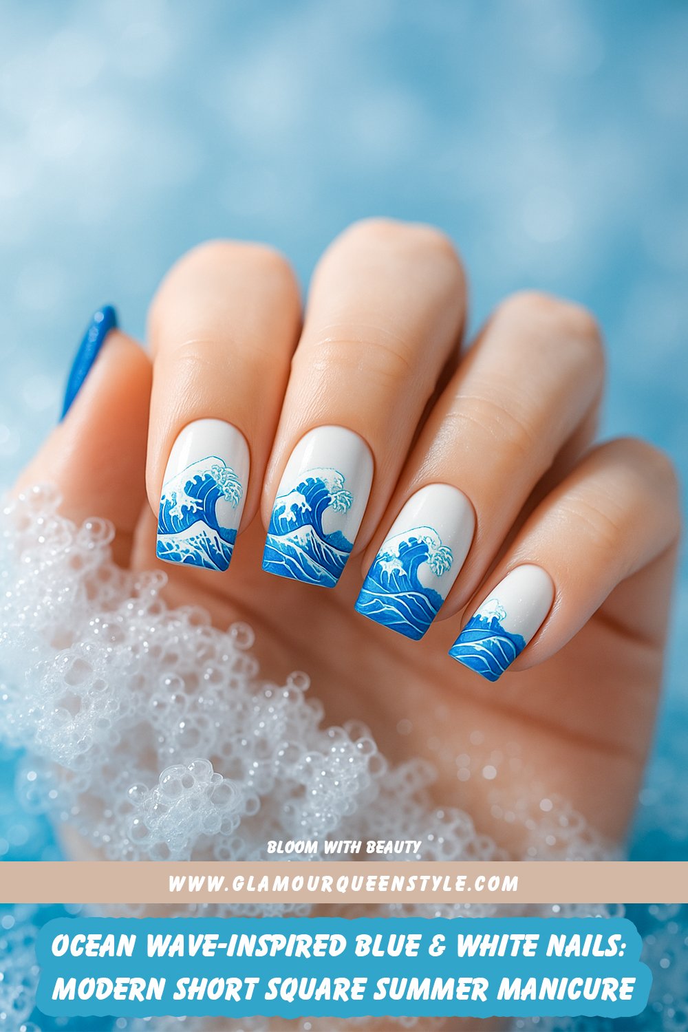 Short square nails painted in white and blue with artistic wave patterns evoke an oceanic feel and a trendy summer style.