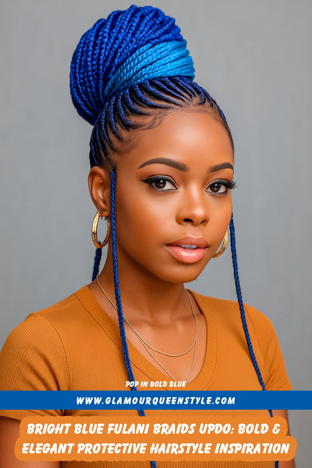 Woman wearing bright blue Fulani braids styled into an elegant updo that highlights intricate braid patterns and showcases confident style.