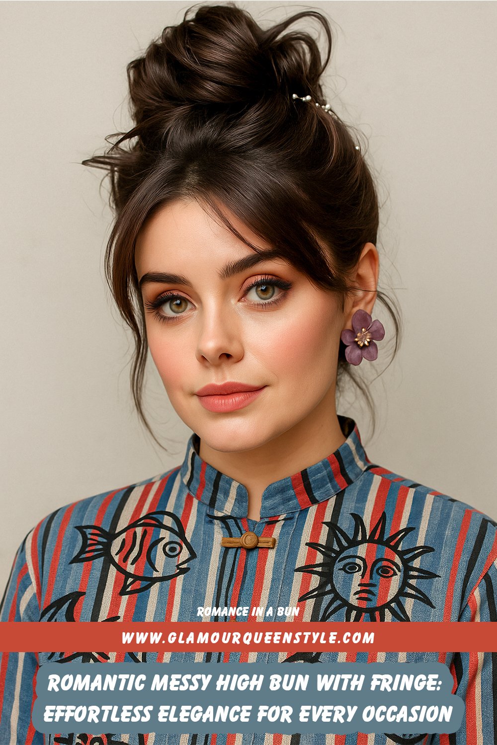 Messy high bun styled on top of the head with loose strands and delicate fringe framing the face; model’s hair exudes undone romance complemented by natural glam makeup and an elegant outfit.