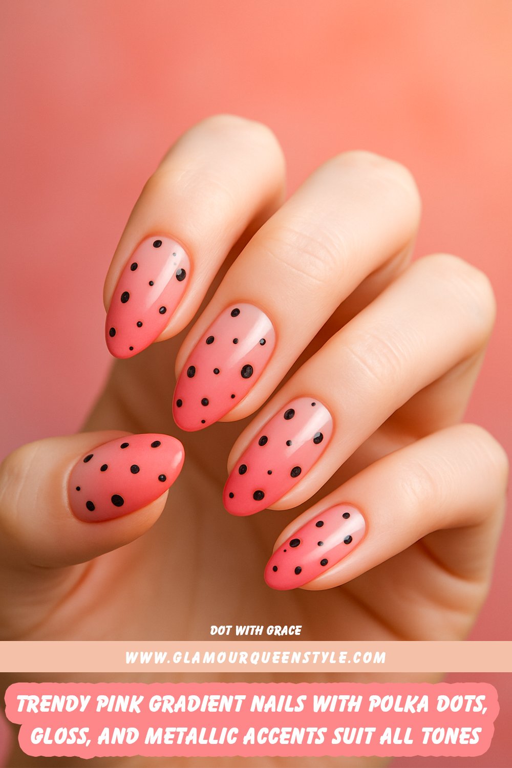 Almond-shaped nails painted in glossy gradient shades of light to deep pink; adorned with small black polka dots of different sizes, some featuring subtle metallic accents for added elegance.