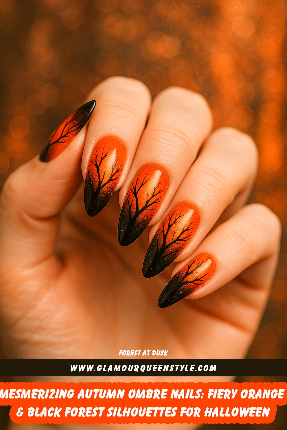 Almond-shaped nails painted in vibrant orange ombré fading into black tips with shimmering glitter accents and intricate black tree branch silhouettes; striking autumn or Halloween-inspired manicure matching various skin tones.