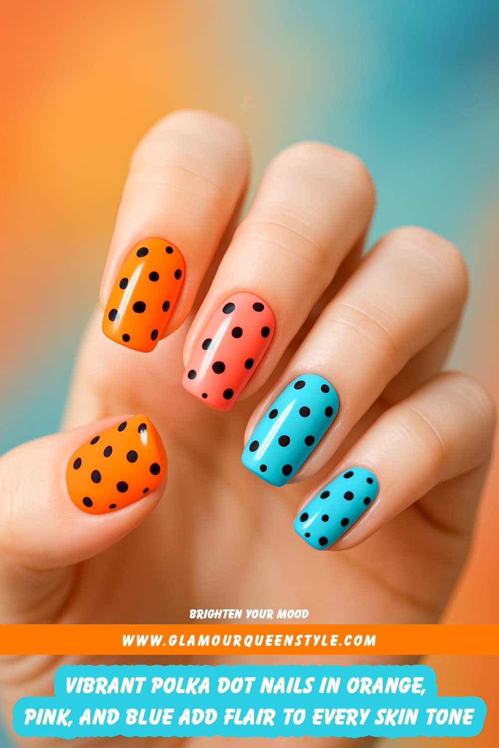 Square-shaped nails painted in glossy orange, peachy-pink, turquoise blue, and sky blue; each decorated with scattered black polka dots for a bold yet whimsical effect.